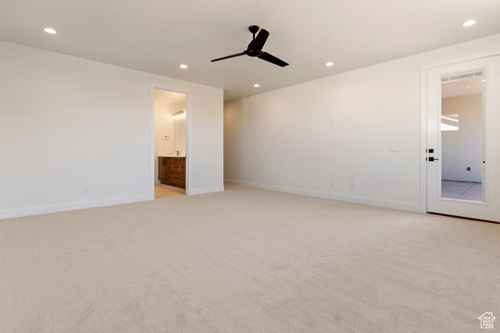 Empty room with recessed lighting, baseboards, light colored carpet, and ceiling fan