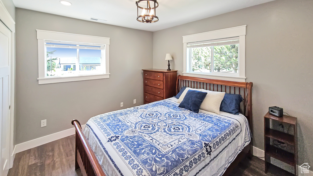 Bedroom featuring baseboards, dark wood-style flooring, and recessed lighting