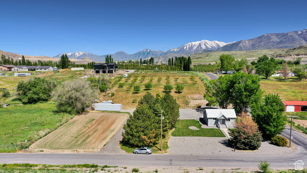 Overview of rural landscape featuring a mountain backdrop