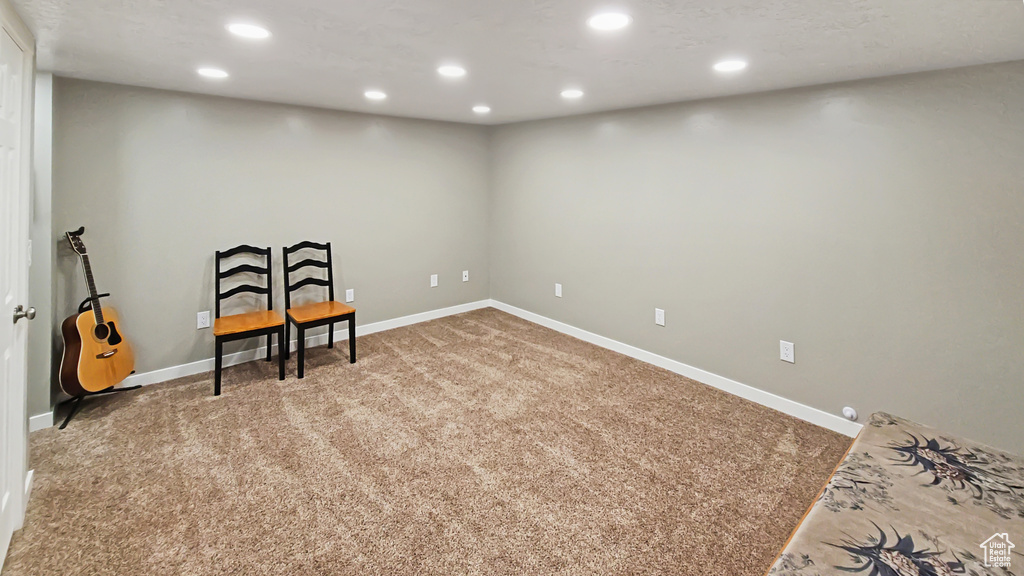 Living area with recessed lighting, carpet floors, and baseboards