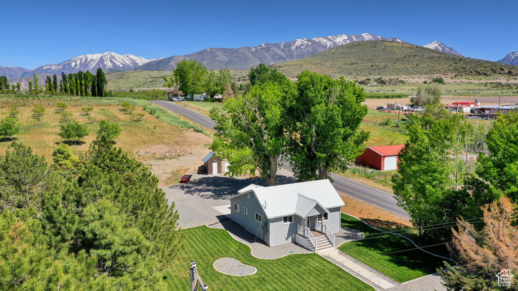 View from above of property with a mountain backdrop