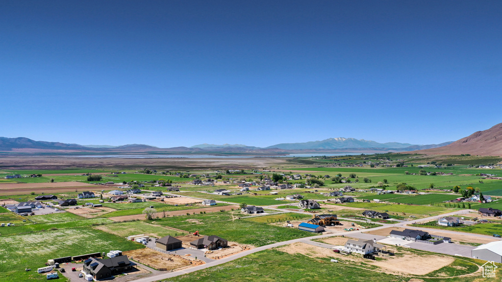 Overview of rural landscape featuring a mountainous background