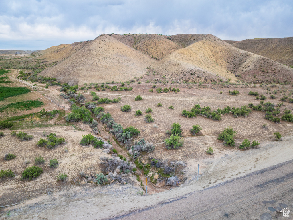 View of mountain backdrop featuring rural landscape