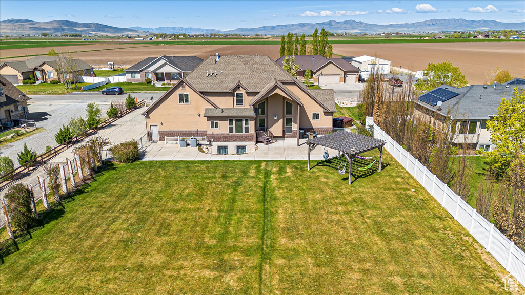 Aerial perspective of suburban area with a mountain backdrop