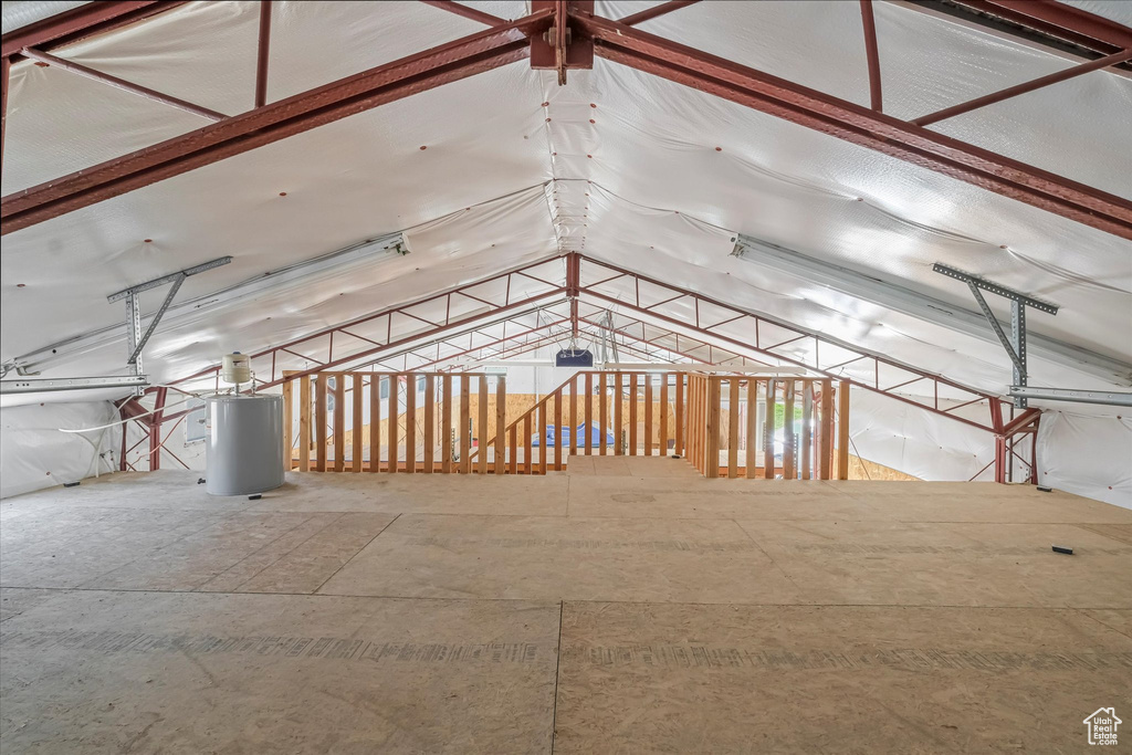 Unfinished attic featuring water heater