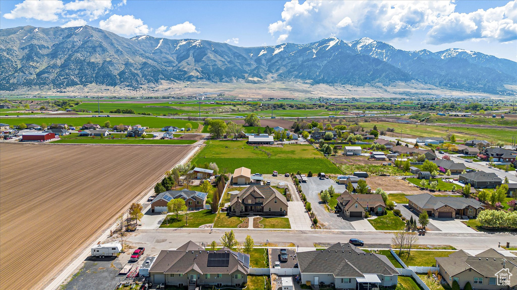Aerial view of residential area featuring a mountainous background