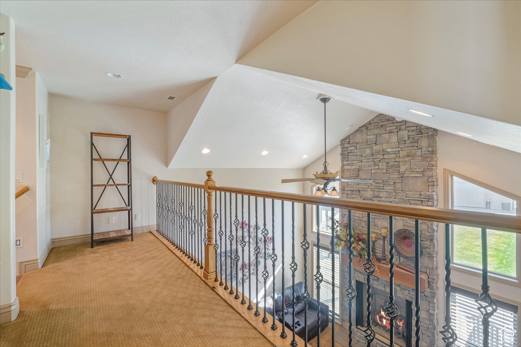 Hallway with recessed lighting, baseboards, vaulted ceiling, and carpet