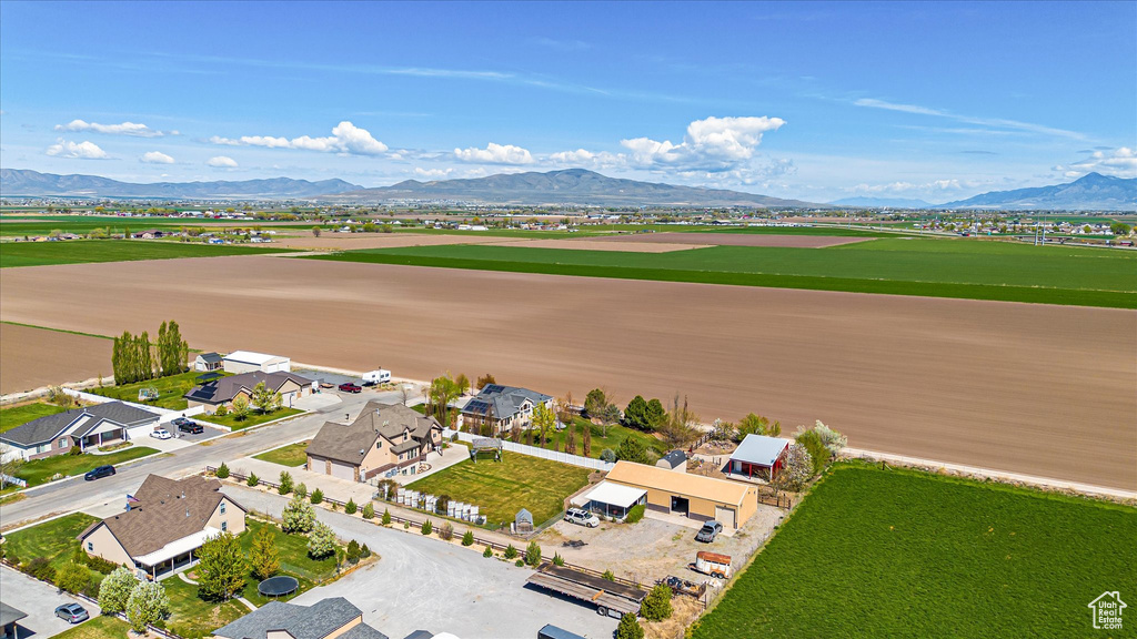 Aerial view of residential area with mountains and a golf course