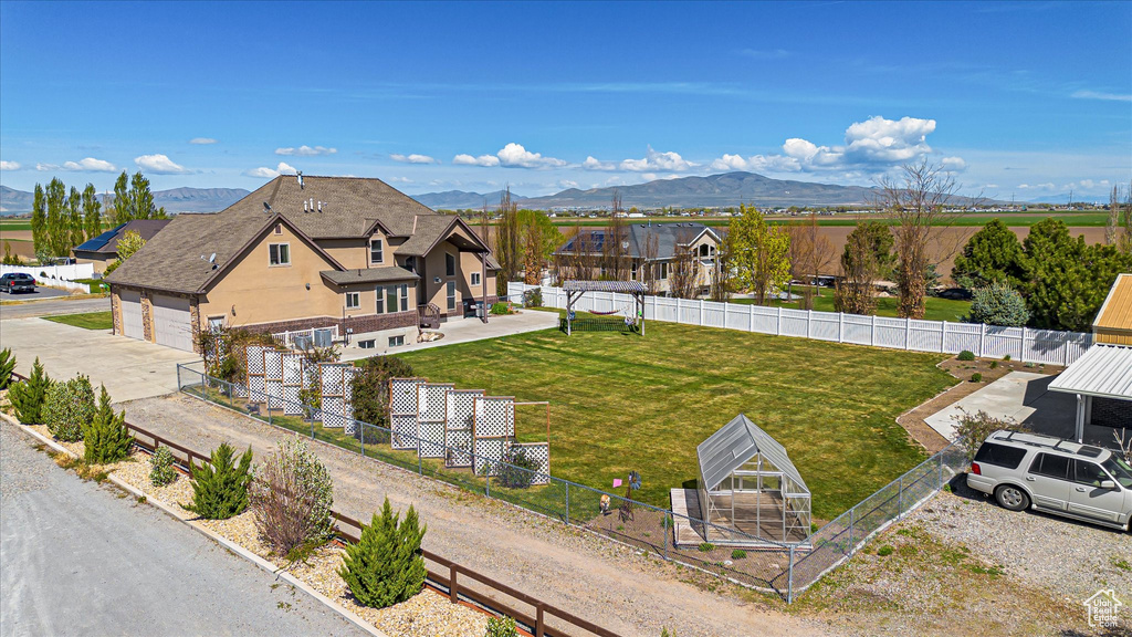 View of subject property featuring mountains