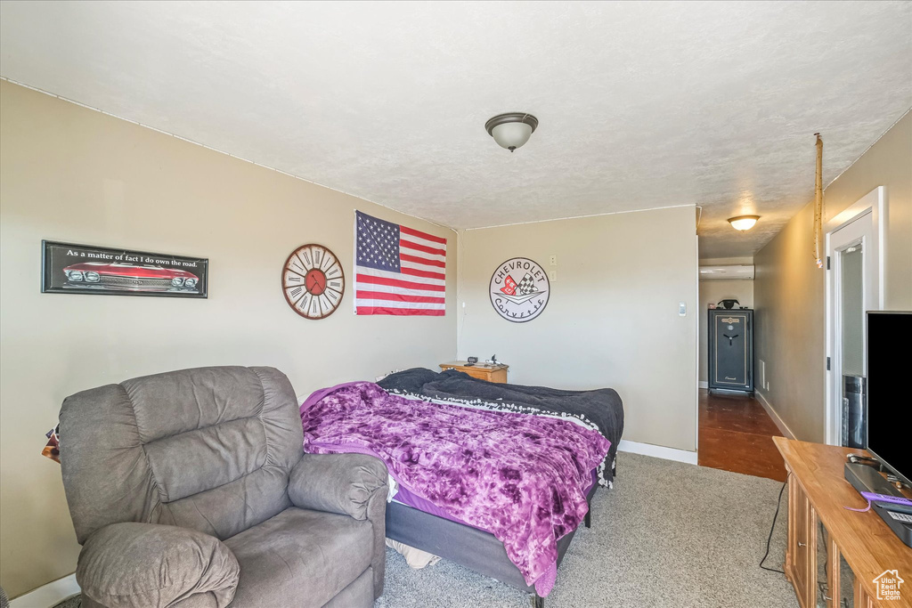Bedroom with carpet flooring and baseboards