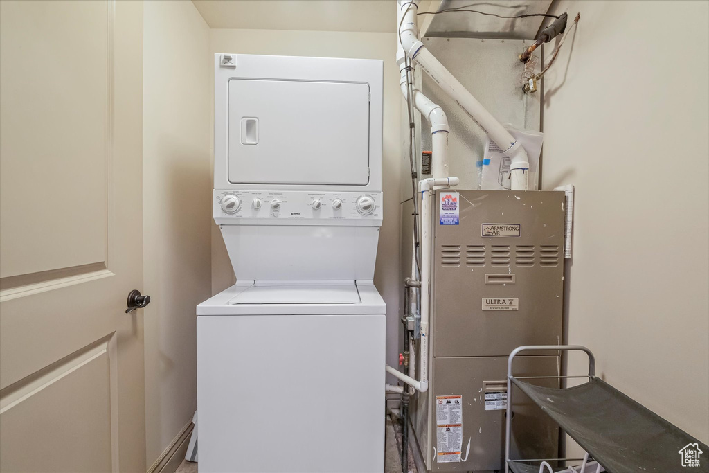 Clothes washing area with stacked washer / dryer