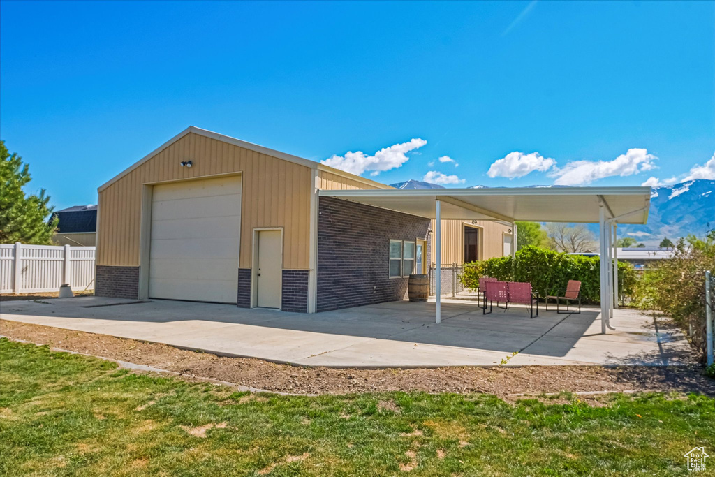 Garage with fence and a detached garage