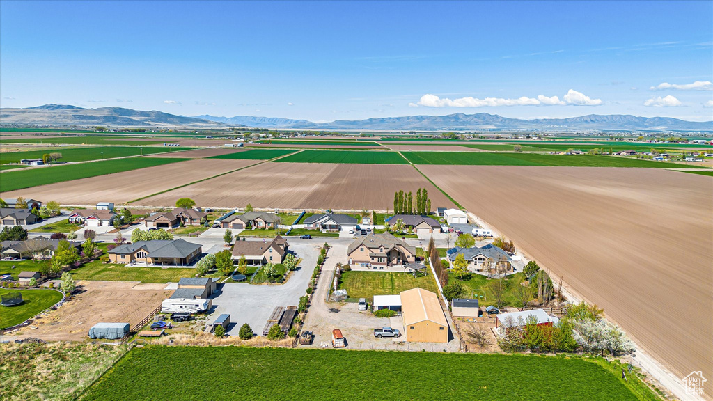 Aerial view of residential area featuring a mountainous background
