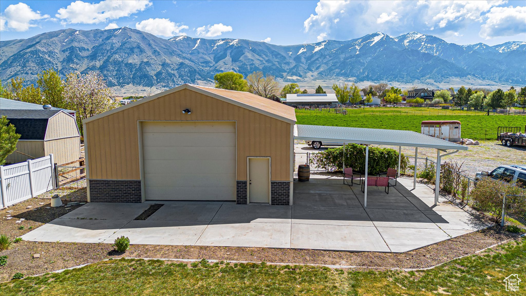 Detached garage featuring a mountain view
