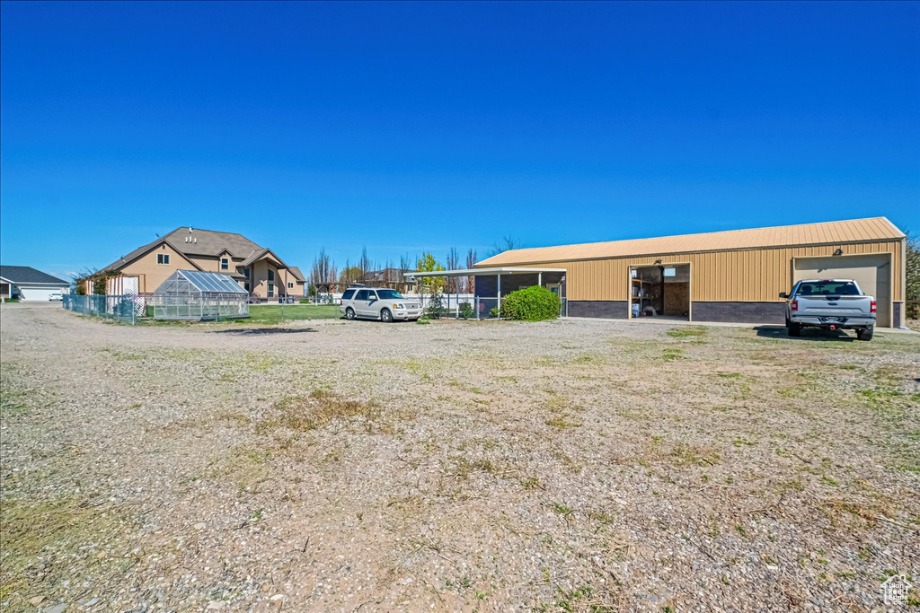 View of yard with an outdoor structure and an exterior structure
