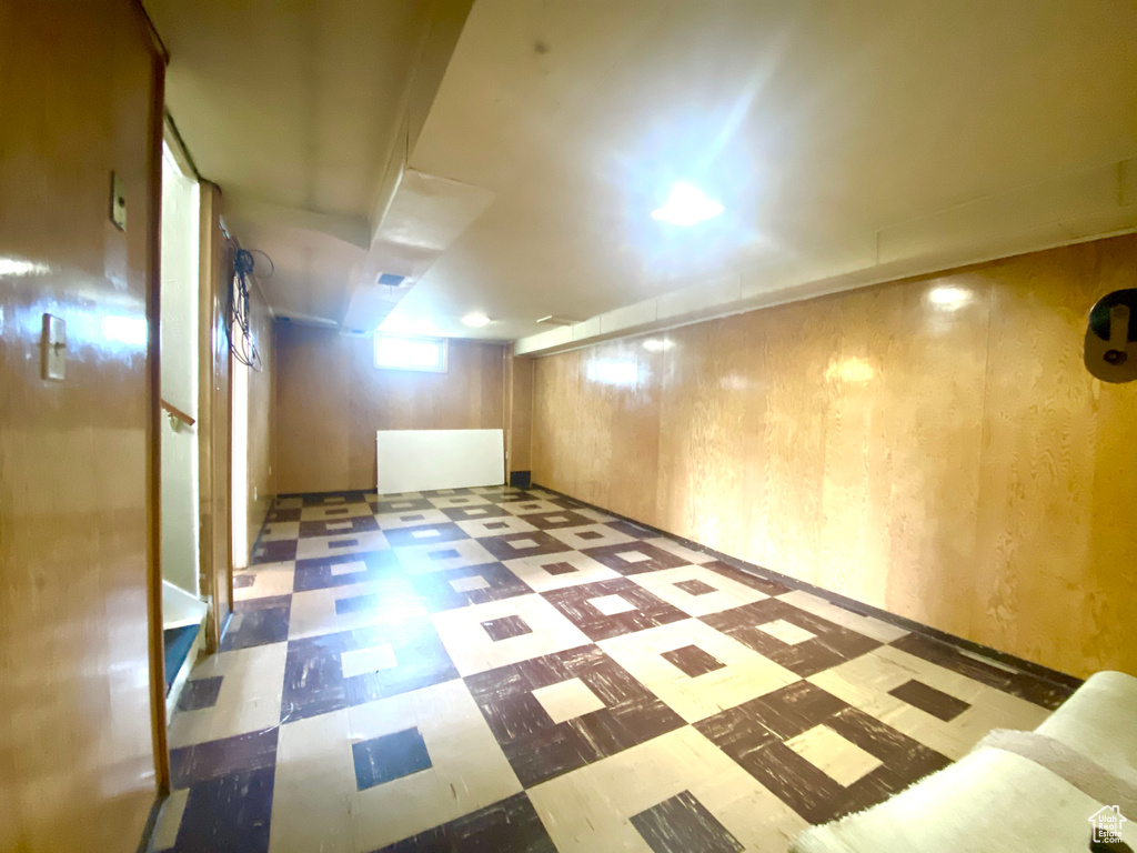 Bonus room with tile patterned floors