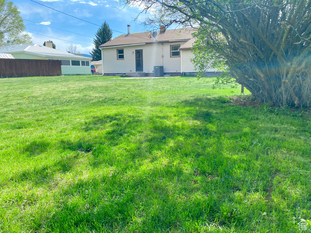 Back of property with central AC unit