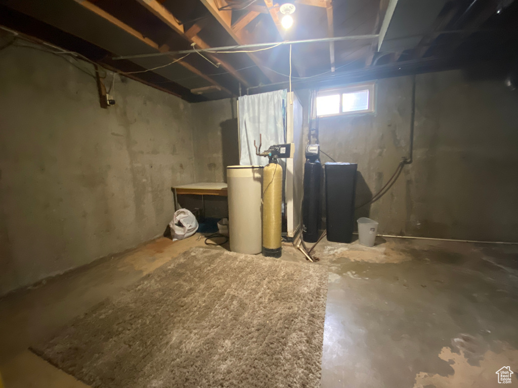 Basement featuring a water softener system