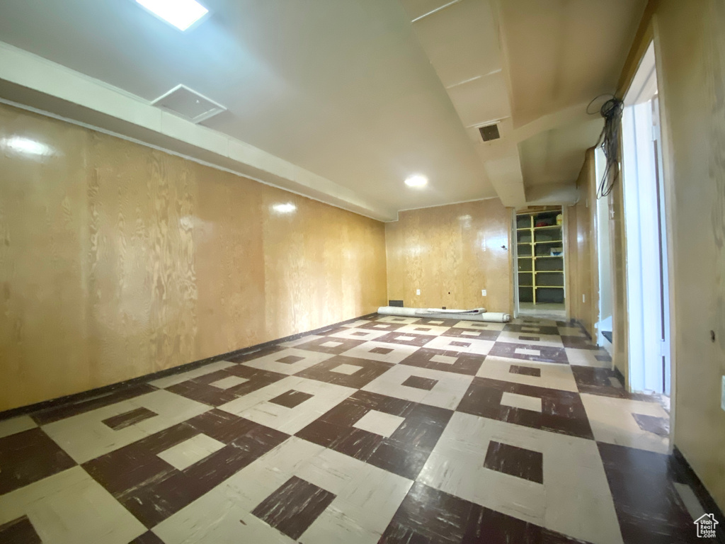 Empty room featuring tile patterned floors, recessed lighting, and baseboards