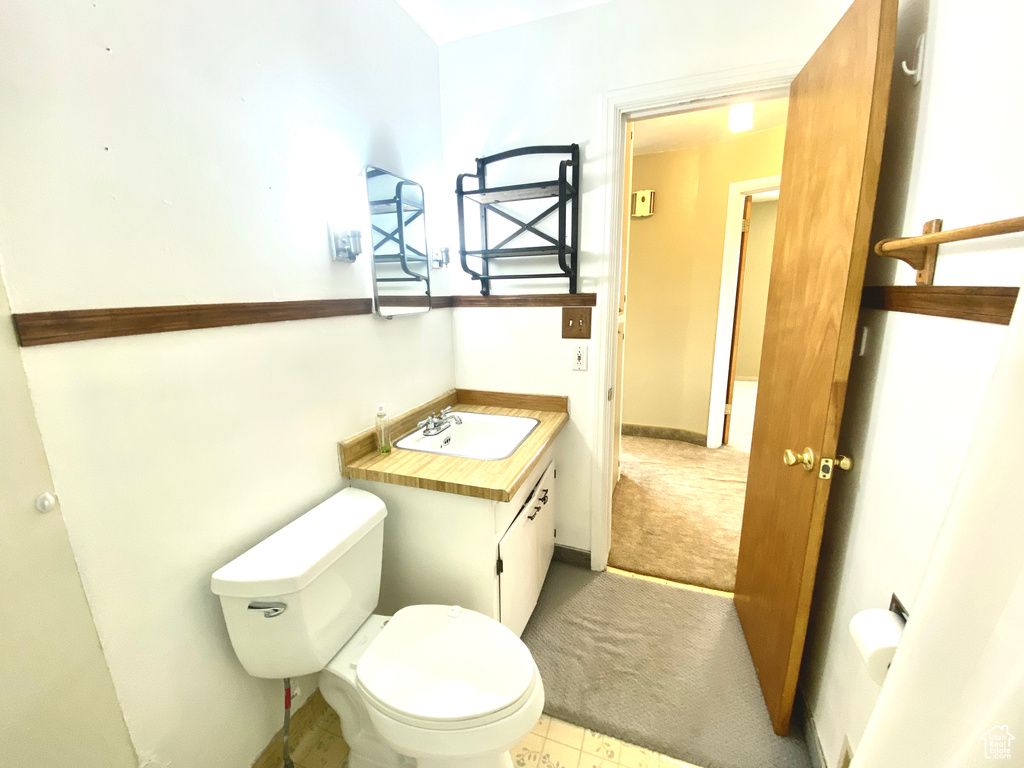 Bathroom featuring toilet and vanity
