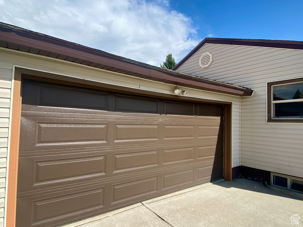 Garage with concrete driveway