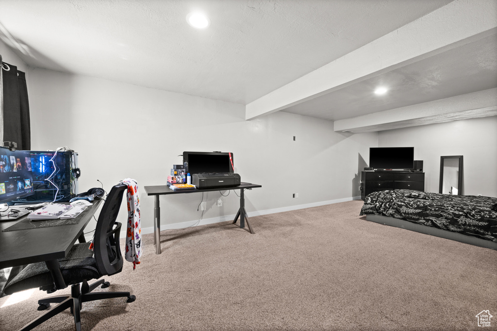 Carpeted bedroom featuring baseboards, recessed lighting, an office area, and beam ceiling
