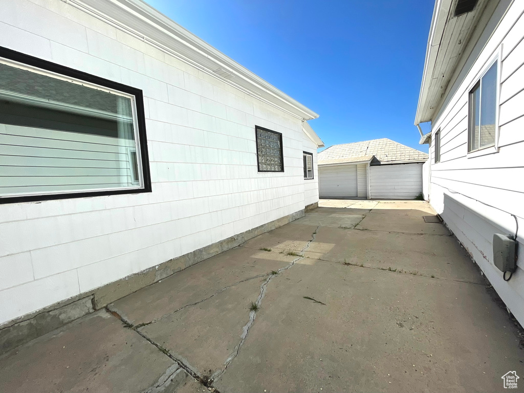 View of side of home featuring a garage