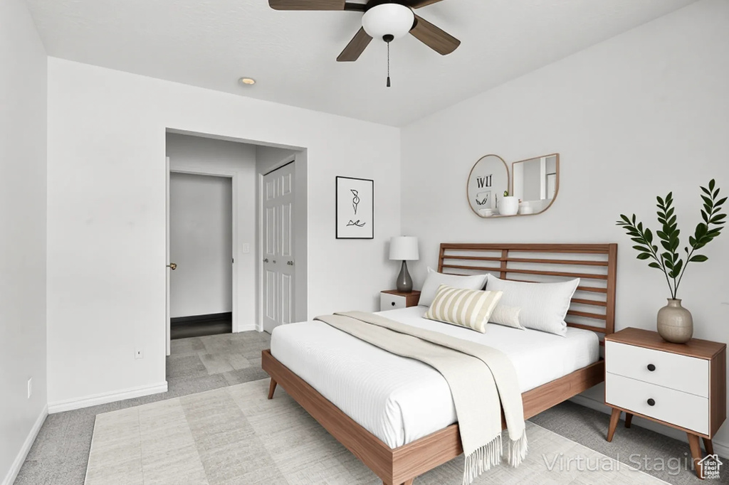 Bedroom featuring carpet floors, baseboards, a ceiling fan, and a closet