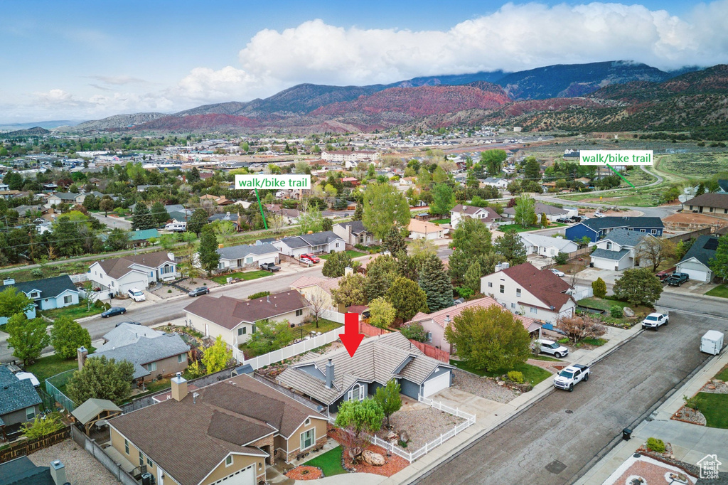 Aerial perspective of suburban area featuring a mountain backdrop