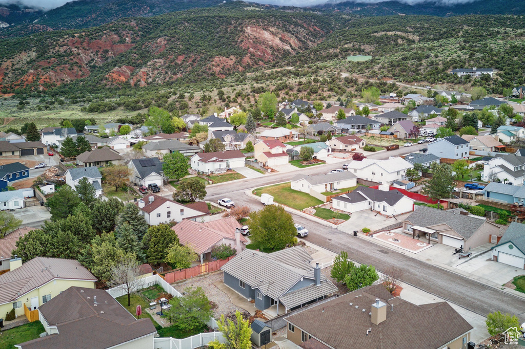 Aerial view of residential area featuring mountains
