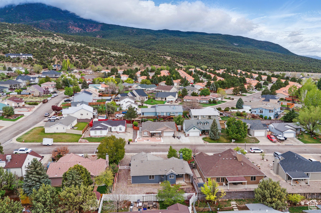 Aerial view of residential area featuring a mountainous background