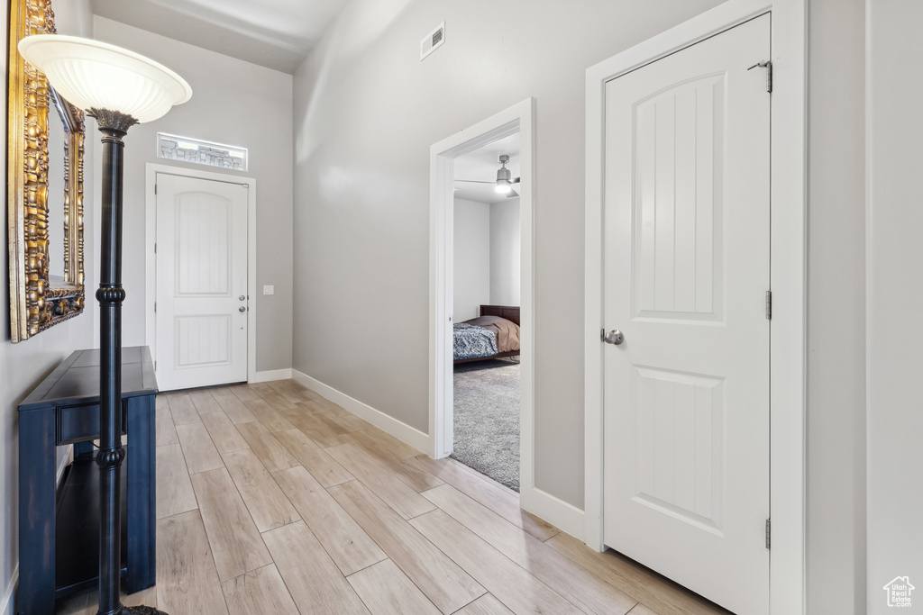 Entrance foyer featuring light wood-style flooring and baseboards