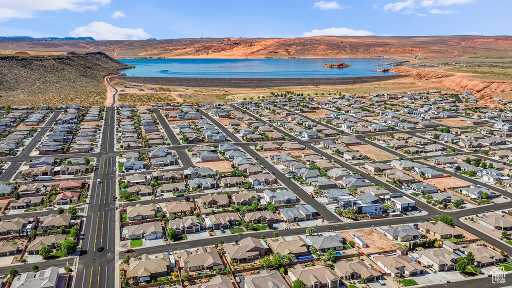 View of property location with a water and mountain view and nearby suburban area