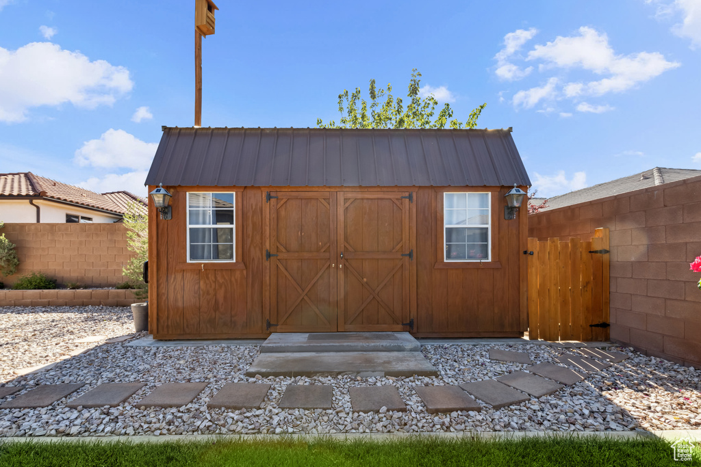 View of shed with fence