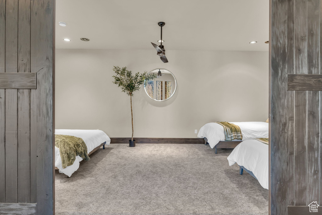 Bedroom featuring carpet flooring, recessed lighting, and baseboards