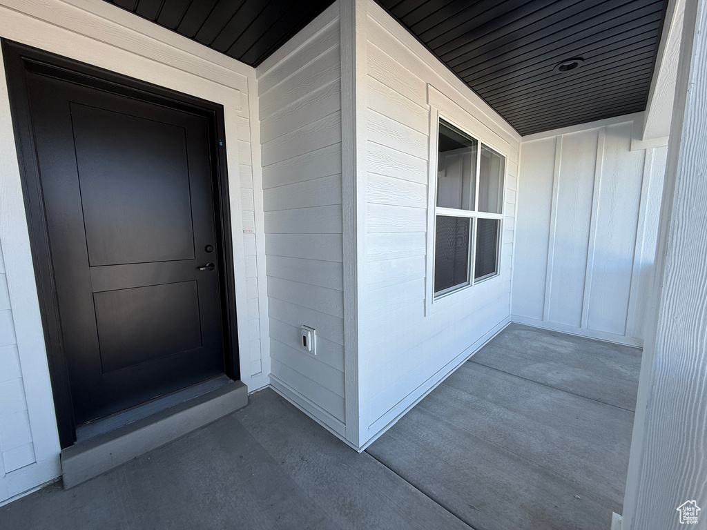 Entrance to property featuring board and batten siding