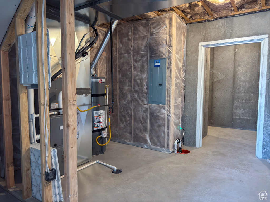 Unfinished basement with electric panel