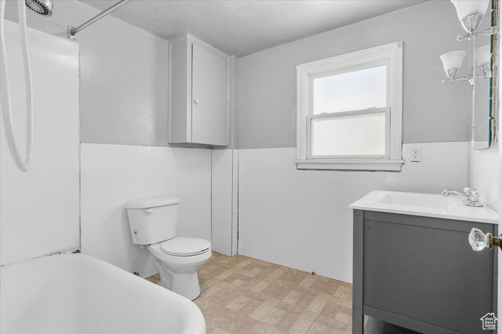 Full bath featuring a bathtub, vanity, toilet, tile patterned floors, and a shower