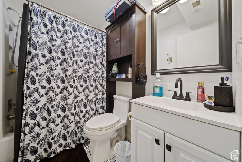 Full bath featuring toilet and vanity