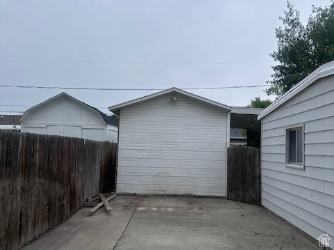 View of patio featuring fence