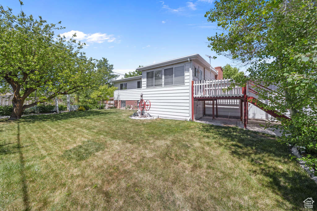 Rear view of property with a wooden deck