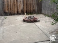 View of patio / terrace featuring a fire pit and fence