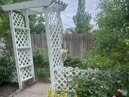 View of yard featuring fence