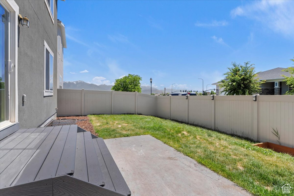 View of yard with a patio