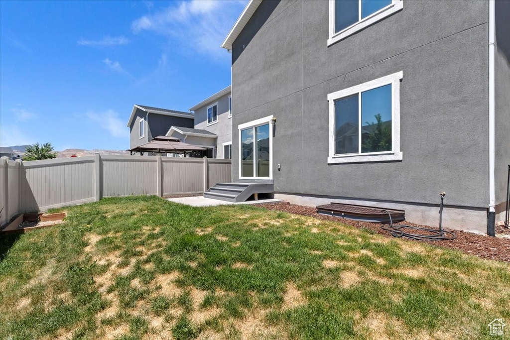 Rear view of house featuring stucco siding