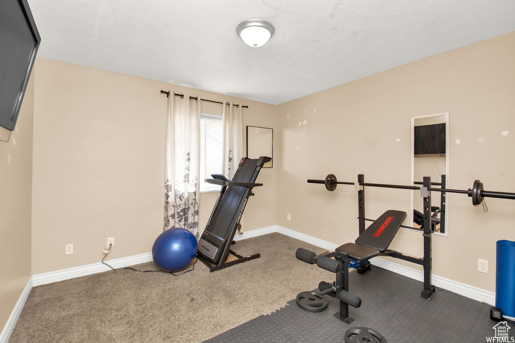 Exercise area featuring baseboards