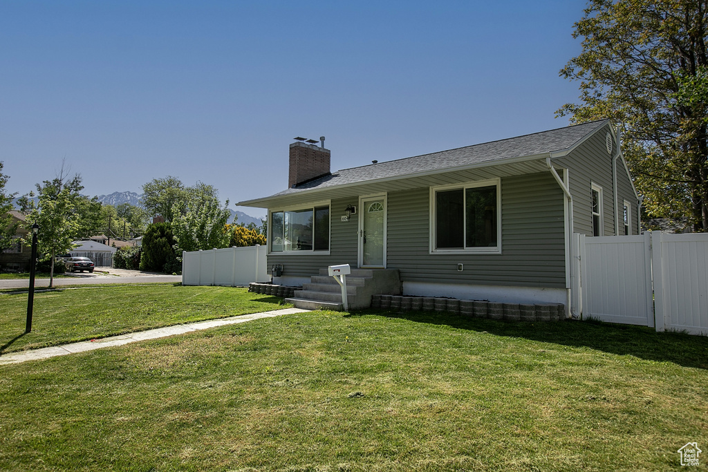 View of front of property with a chimney