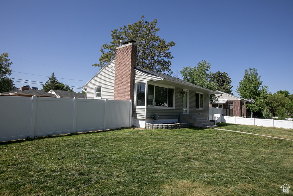 View of front of house featuring a chimney