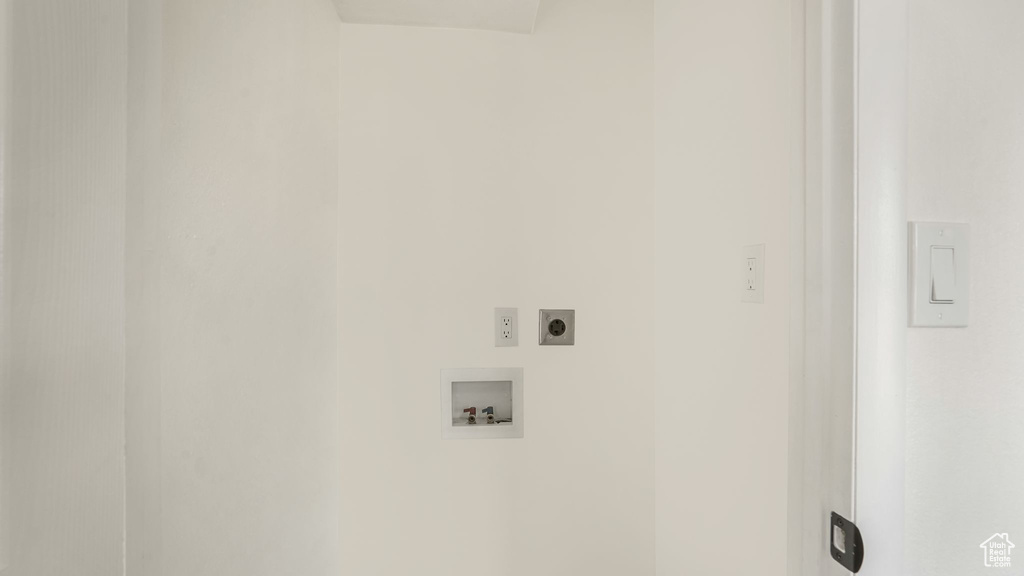 Washroom featuring hookup for an electric dryer and hookup for a washing machine