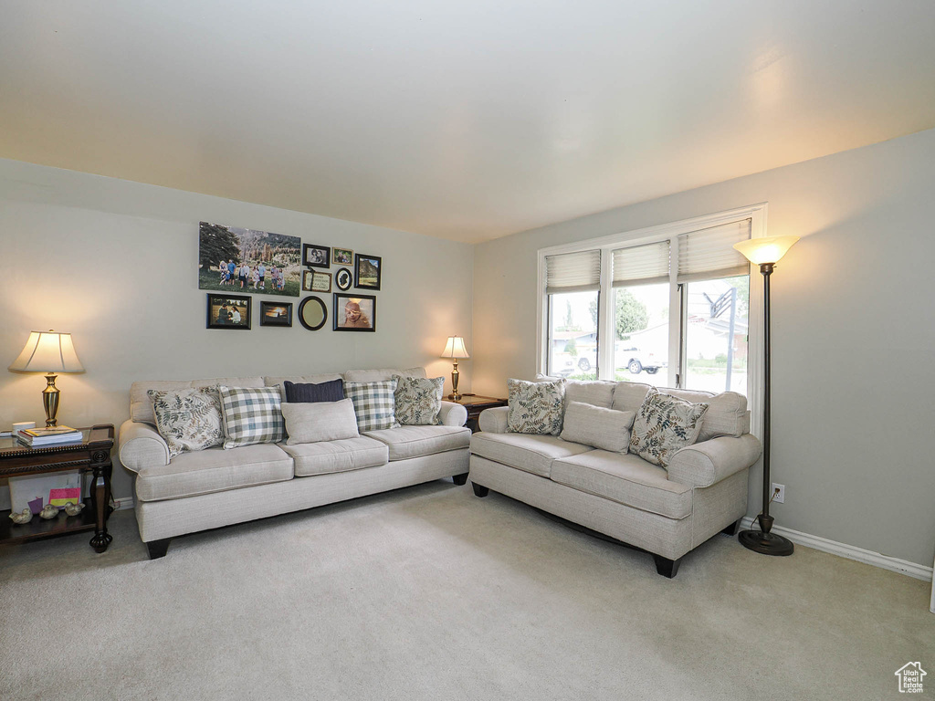 Carpeted living room with baseboards